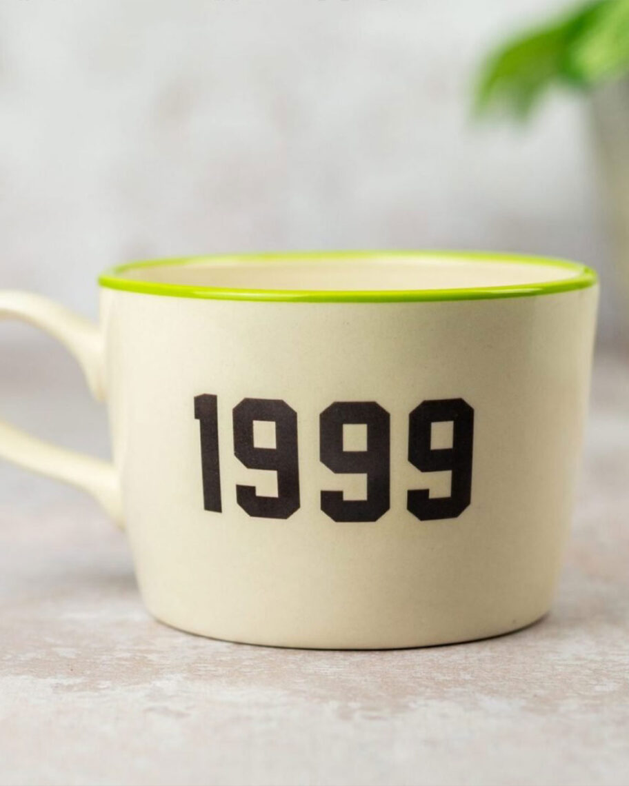 martha brook personalised stationery blog 10 unique birth year personalised birthday gifts kate ceramics personalised birthday mug. A cream coloured mug with a lime green rim and bold black text that reads '1999'.