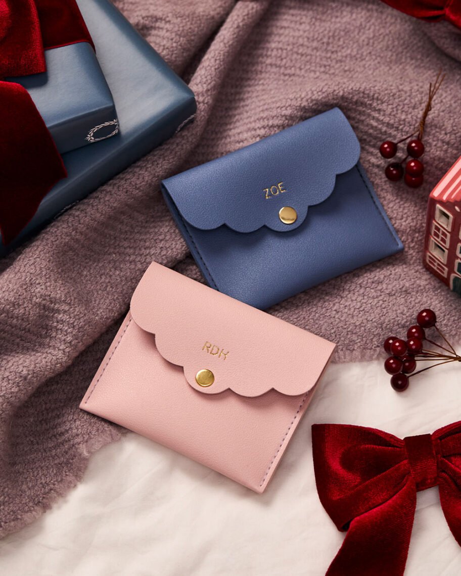 martha brook blog post martha's top christmas gifts personalised scallop mini pouch on bed with blanket and red berries