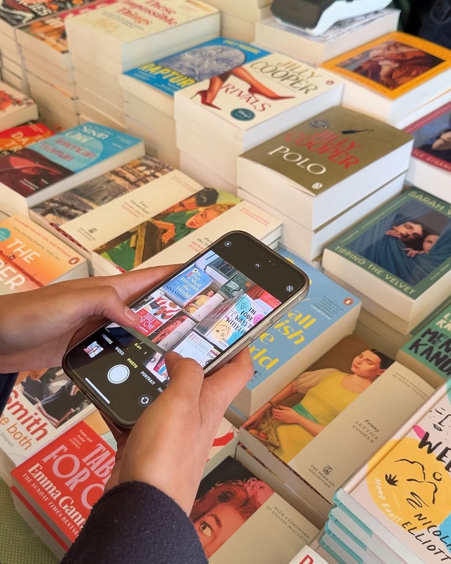 martha brook martha's journal women's prize live a person taking a photo of a table of books