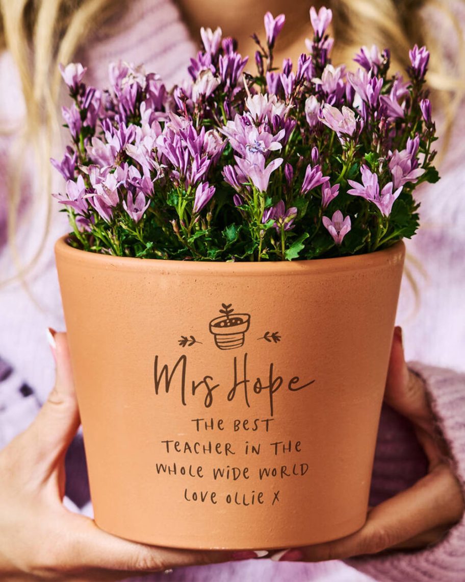 martha brook blog thank you teacher gift guide personalised planter filled with purple flowers being held